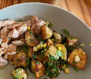 potatoes, corn mixed in cilantro, red chilli flakes and garlic