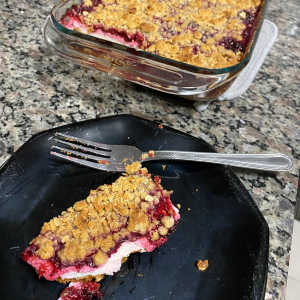 layered oat crumble with yogurt and raspberry compote