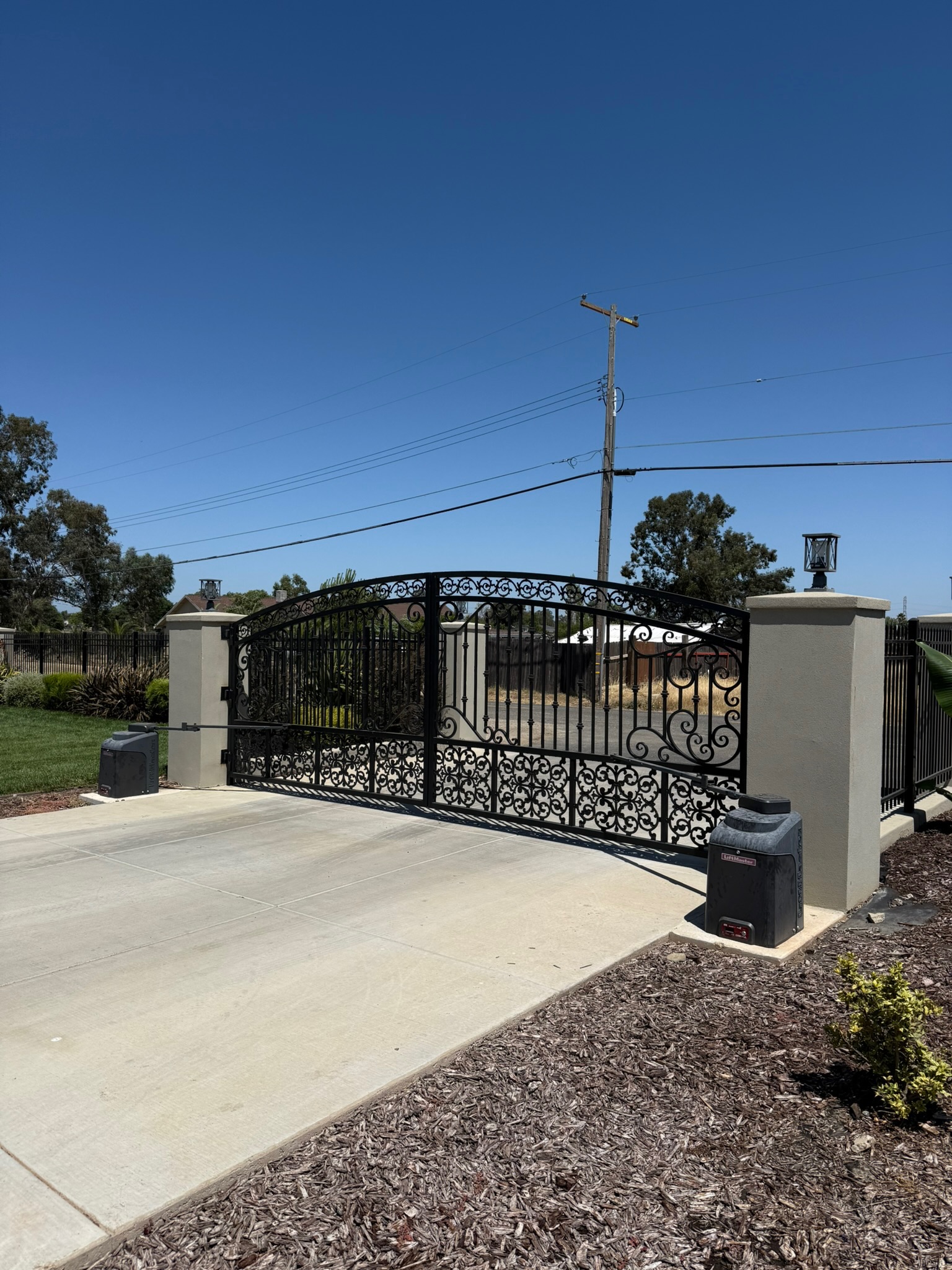 Installed ornamental wrought iron driveway gate by DC Controls in Elverta, CA
