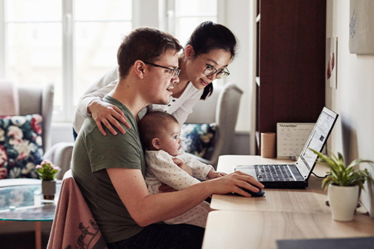 Family looking at homes for sale on their laptop