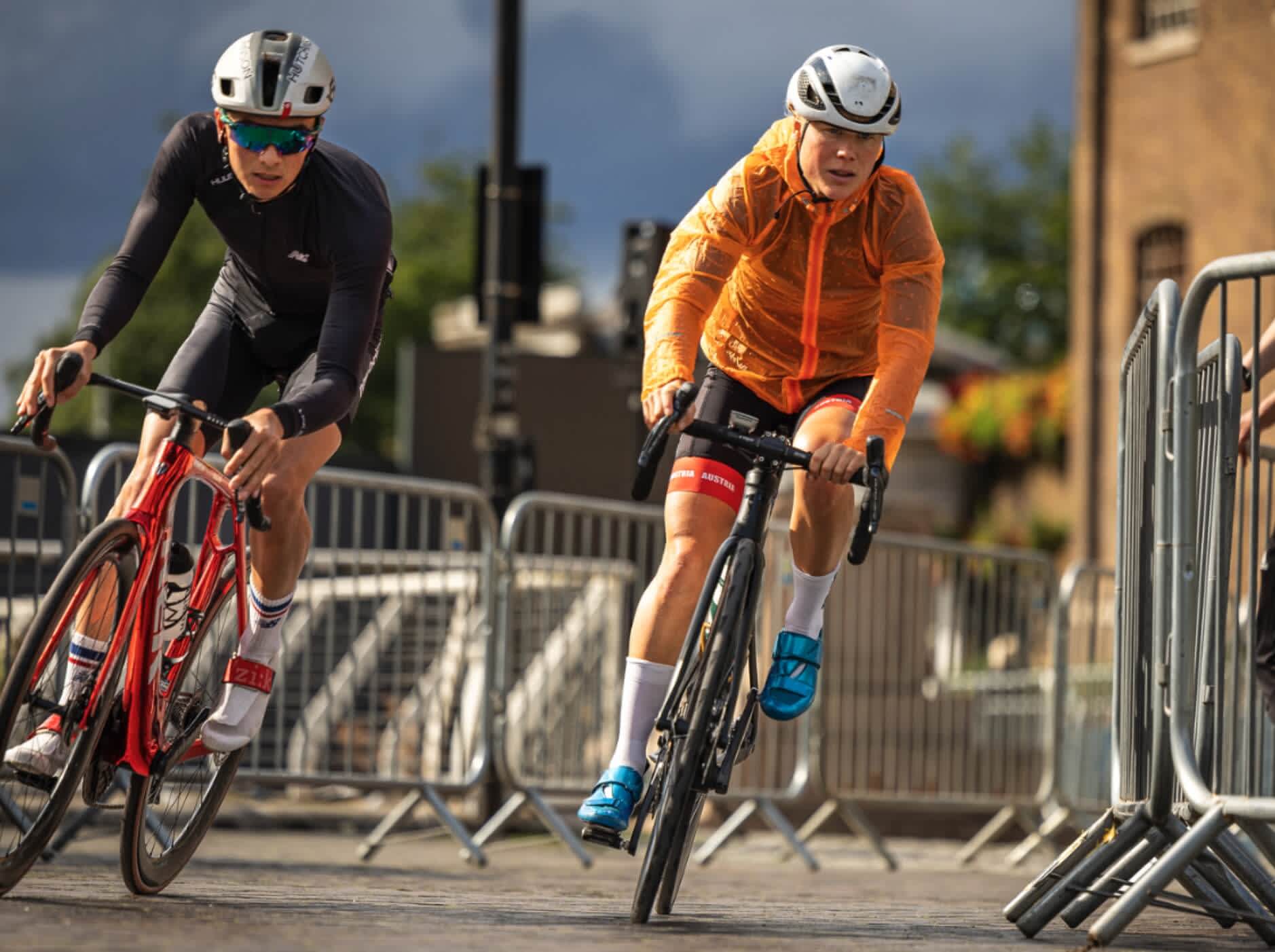 2 male bike riders taking a corner together1