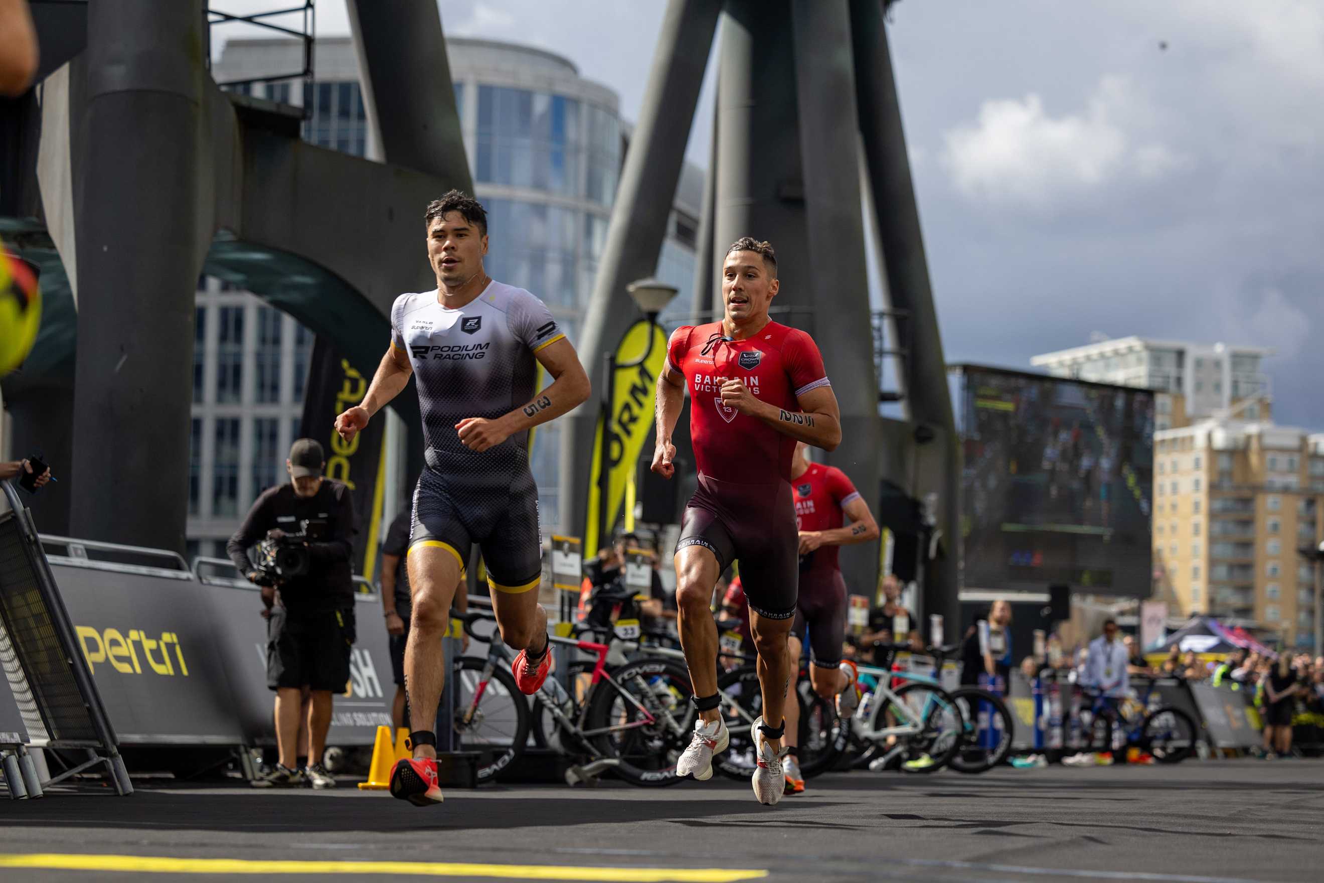 Kenji Nener and Vincent Luis running at supertri London