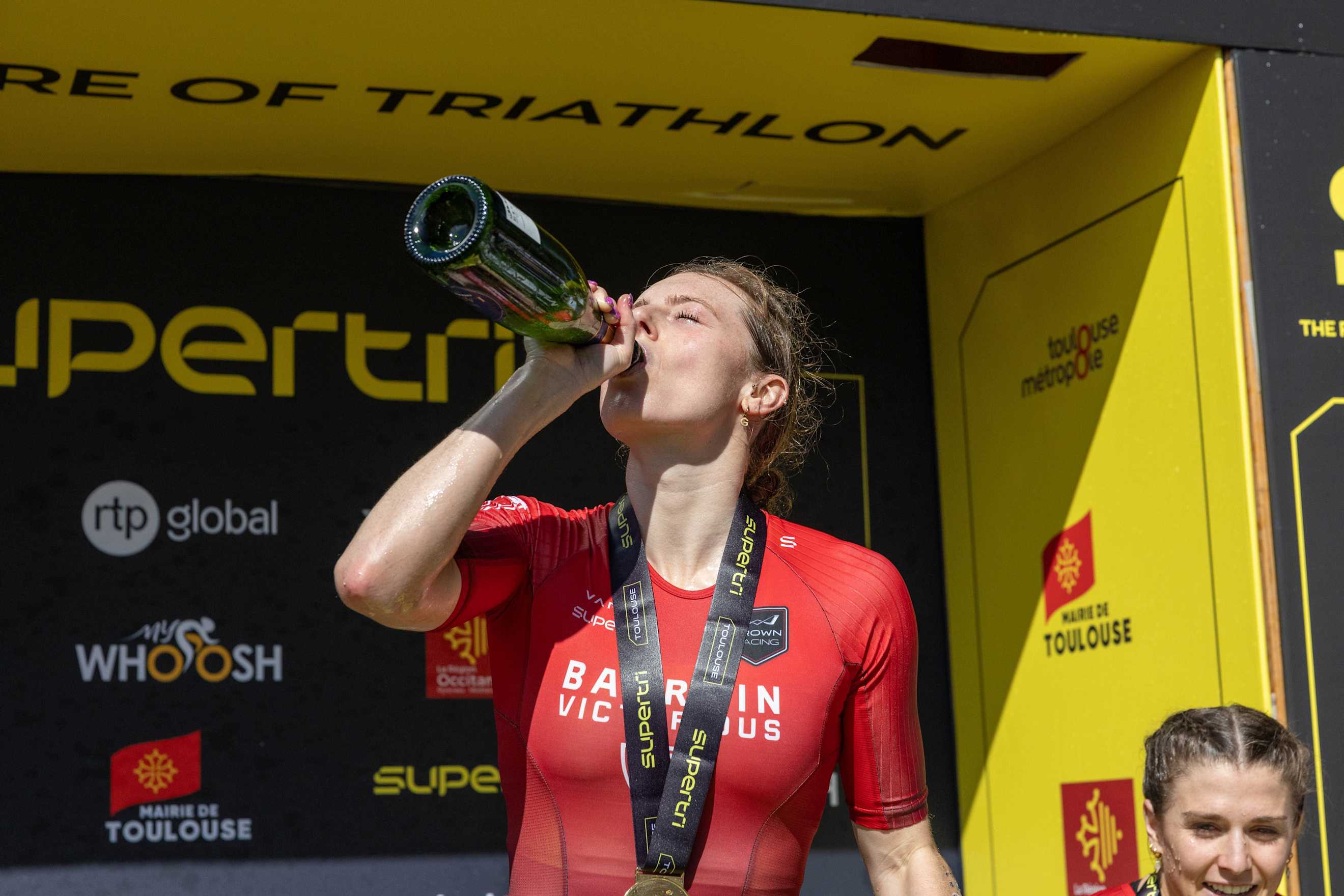 Georgia Taylor-Brown celebrating at supertri Toulouse 2024