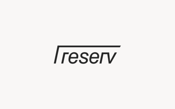Reserv logo in minimalist black text on a light pink background.