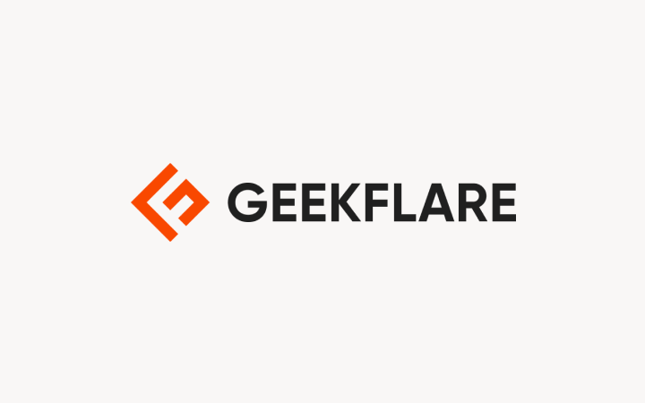 GeekFlare logo featuring an orange geometric symbol next to black text on a light pink background.