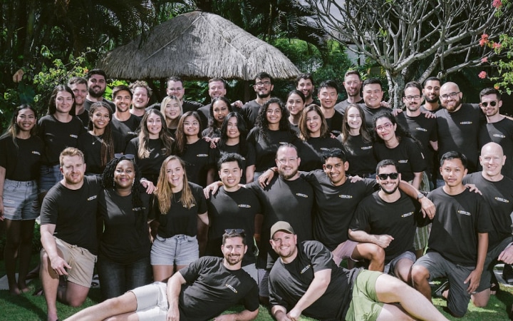 Photograph of a group of smiling Sitemate employees