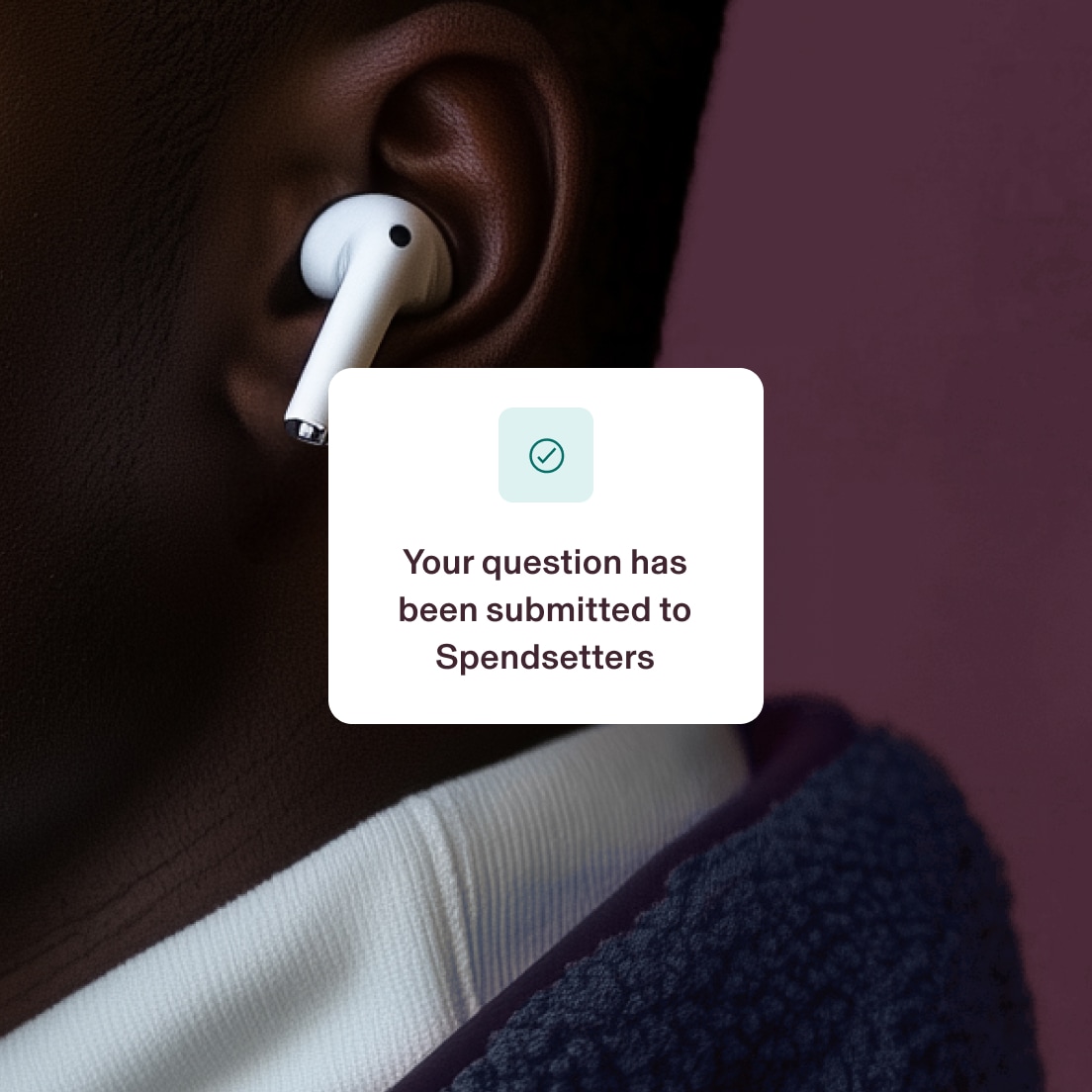 Close-up of a person wearing a wireless earbud. A notification message in the foreground reads, "Your question has been submitted to Spendsetters," accompanied by a checkmark icon.