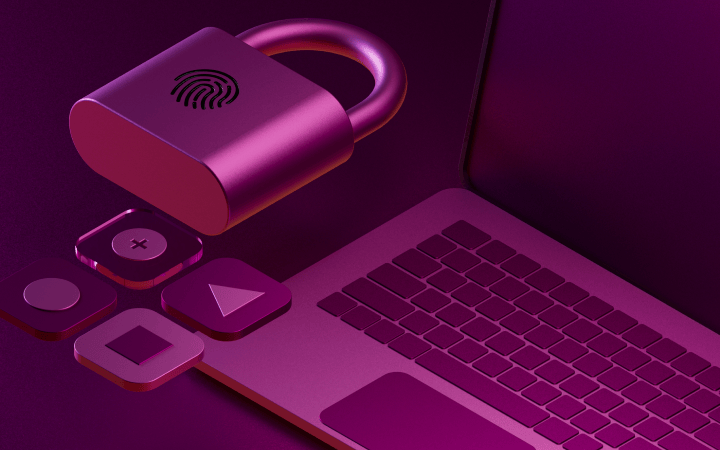 Purple fingerprint padlock with app icons beside a laptop keyboard in magenta lighting, representing digital security.