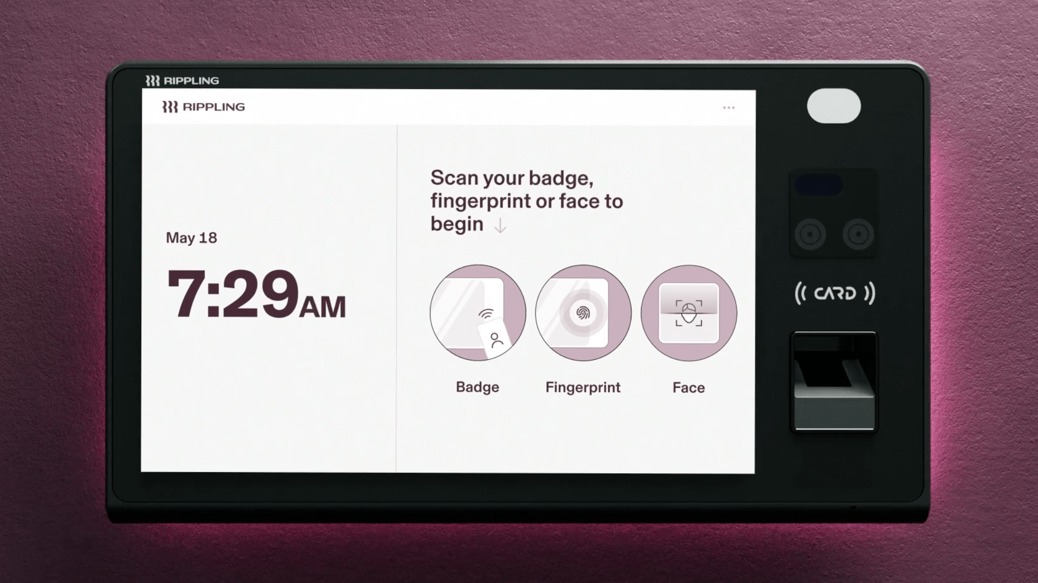 Photograph of a device that looks like a tablet mounted on a wall with a screen showing the Rippling logo, the time, and a message that says "Scan your badge, fingerprint or face to begin"
