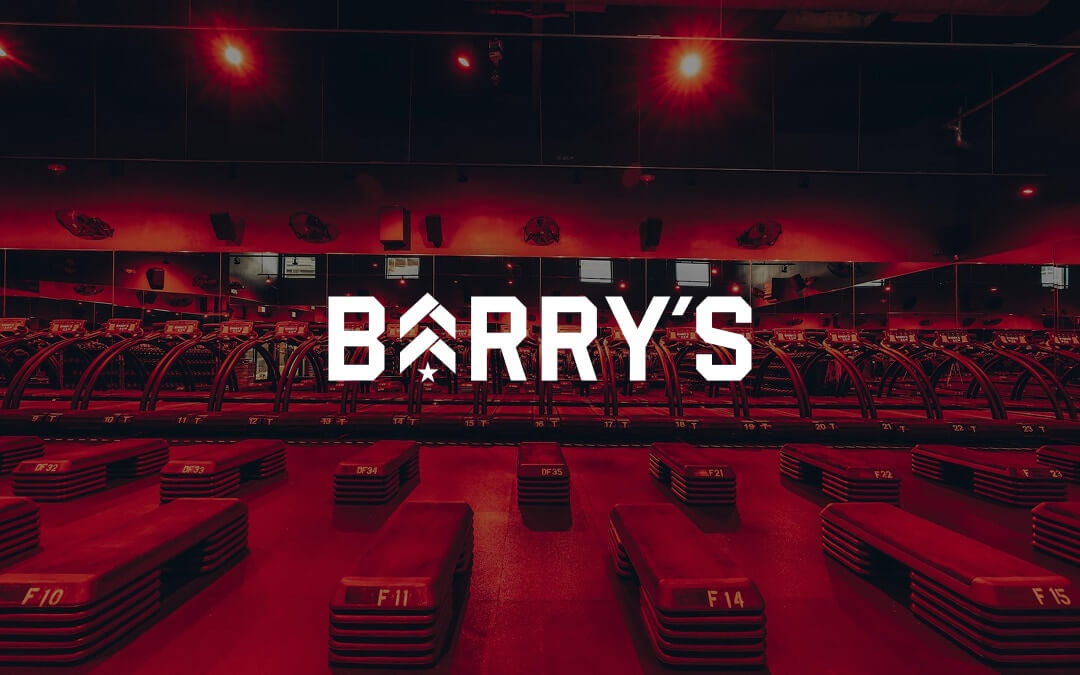 Barry's logo over a photograph of a Barry's gym