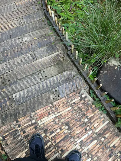 Pathway to Takyo Abeke laid with ceramic roof tile production by-products