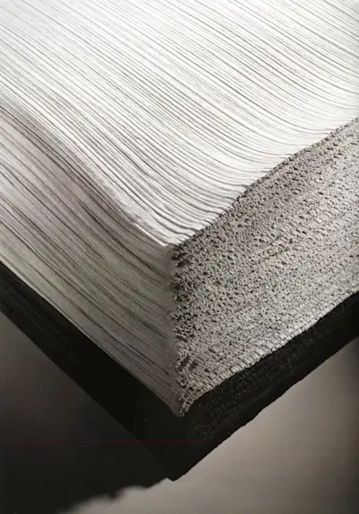 After the pleats treatment, the finished pieces are layered on top and transported for inpection