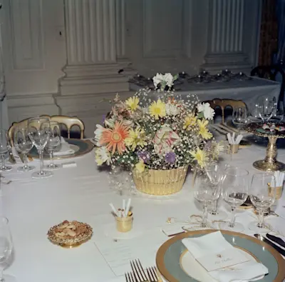 Table Settings and Floral Arrangements for Dinner in Honor of the King of Morocco, Hassan II in 1963. Photo courtesy of John F. Kennedy Presidential Library and Museum.
