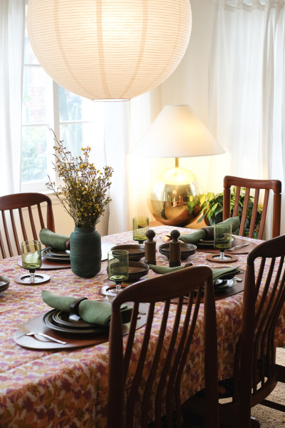 Table spread with Studio Ford Cactus Flower Tablecloth, Peter Speliopoulos for Commune Leather Placemats, Napkins, and The Long Confidence Napkin Rings