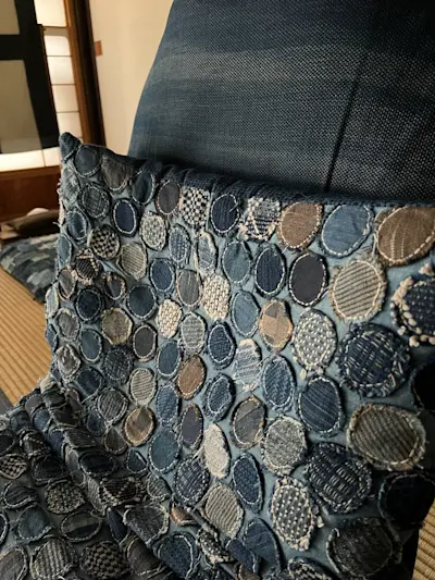 Embroidered pillow at Takyo Abeke
