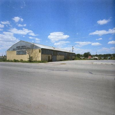 South facade of west building from US Highway 90. Photo 1973.