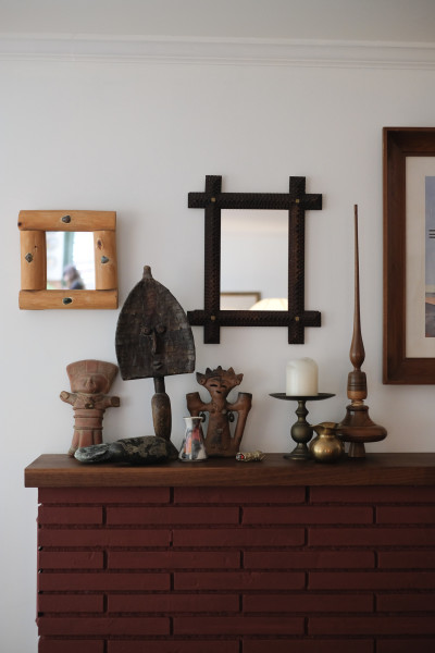 Figurines above fireplace mantle