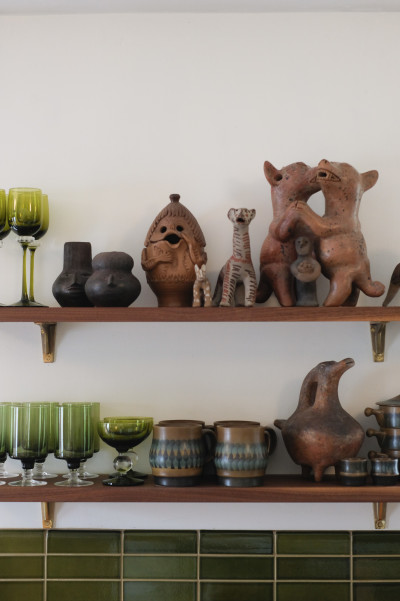 Figurines on kitchen shelves