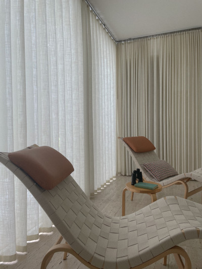 Another view. Natural colored drapes were demanded by Mies.