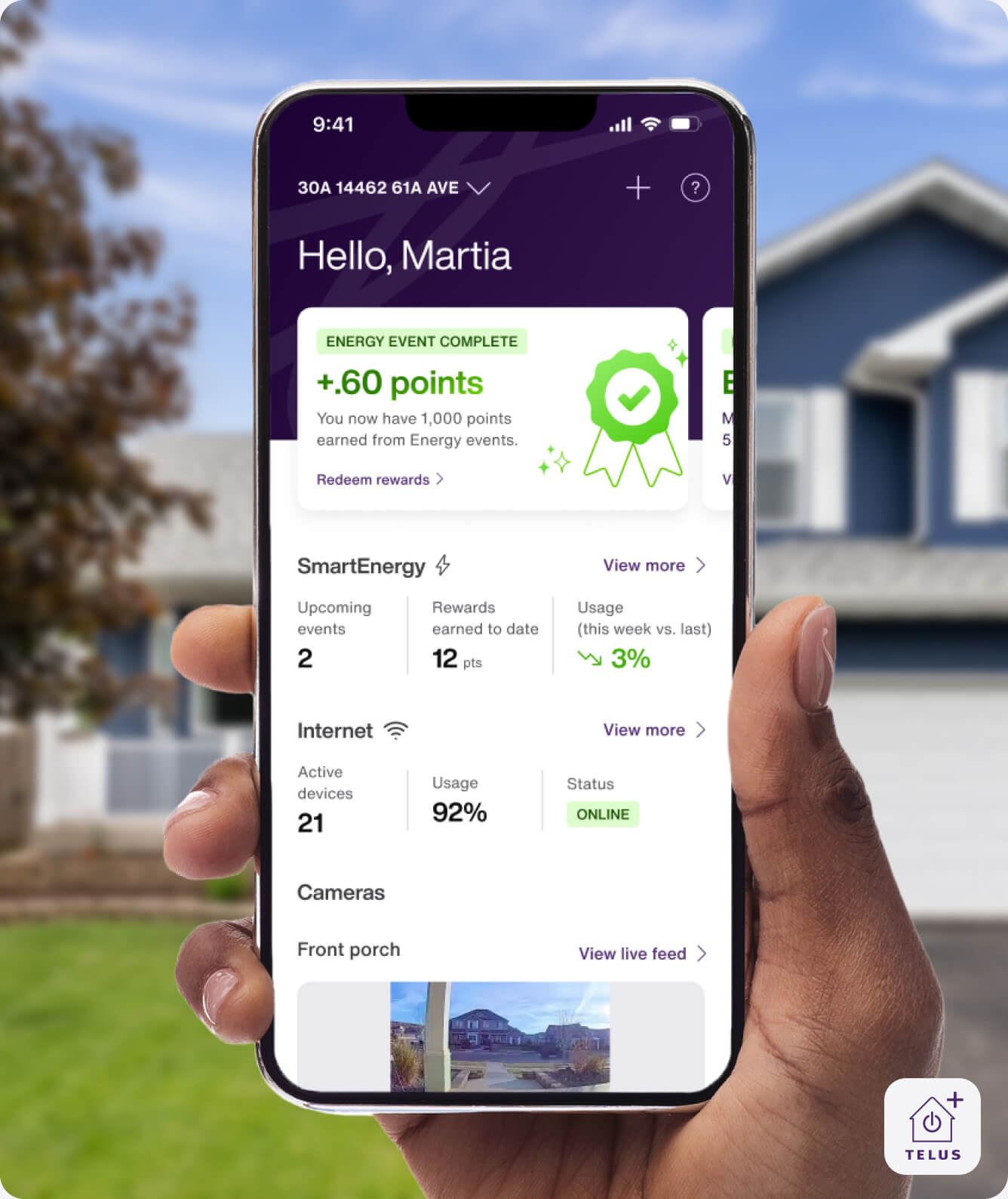 A hand holds the TELUS SmartHome+ app showing a summary of a successful energy savings event completed and the internet connection in your home.