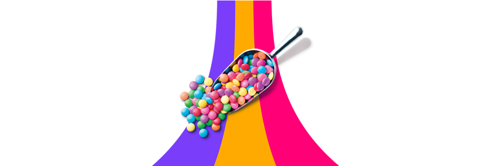 A candy scoop with brightly coloured candies is shown.