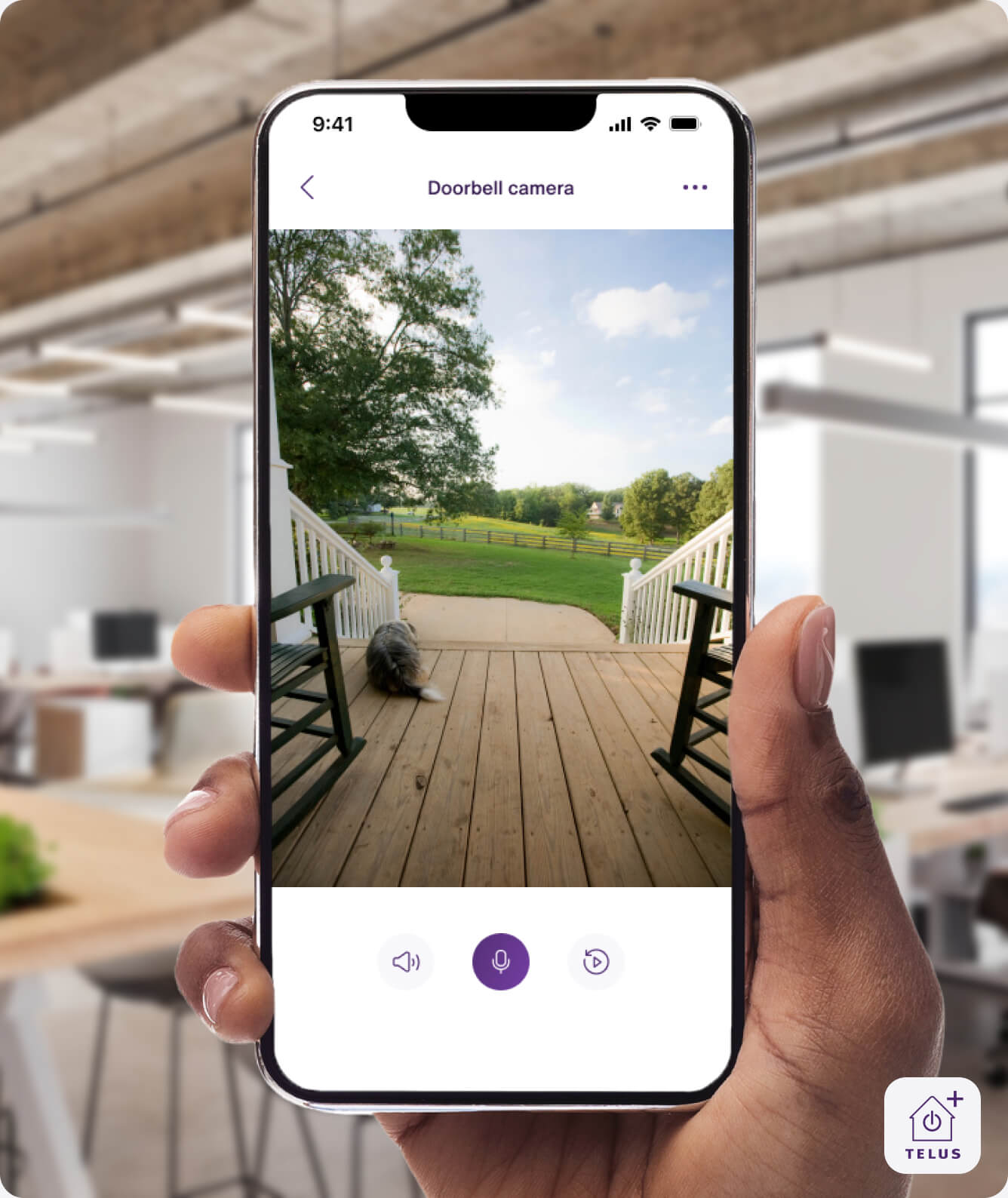 A hand holding the TELUS SmartHome+ app showing the recording from the TELUS Doorbell Camera.