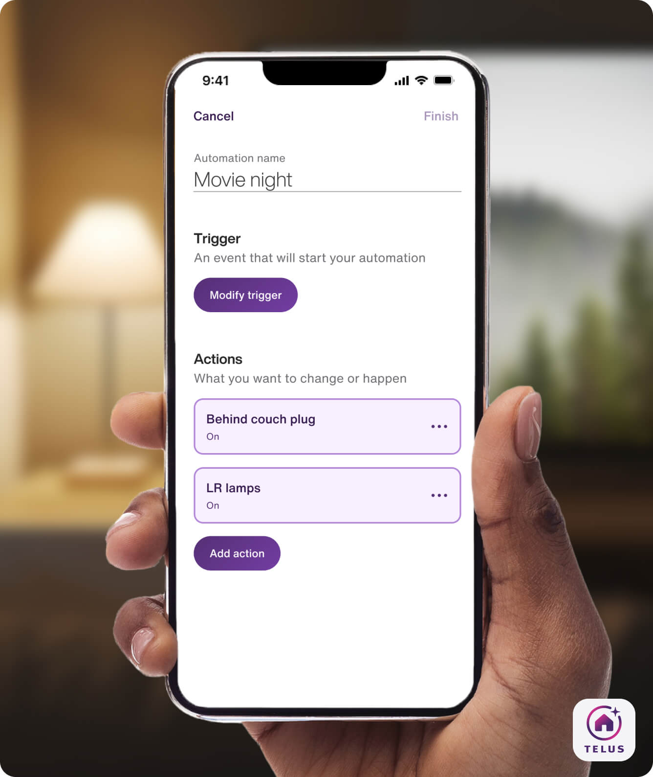 A hand holds the TELUS SmartHome+ app while getting ready to watch a movie at home. It is showing a customized Movie Night routine to dim the lights.