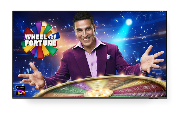 A TV displaying the 'Wheel of fortune' poster and the Sony LIV logo on the lower left corner.