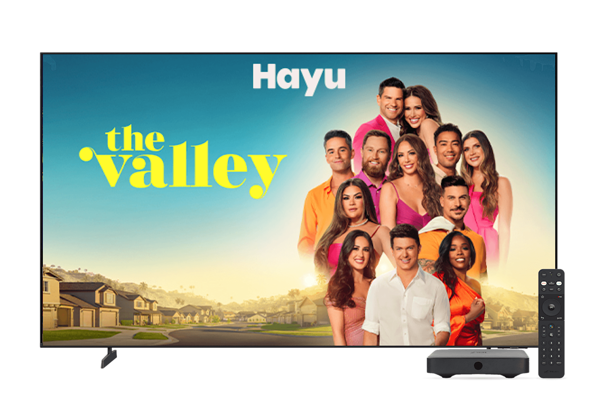 A screen showing the Valley on Hayu next to a digital TV box and remote.