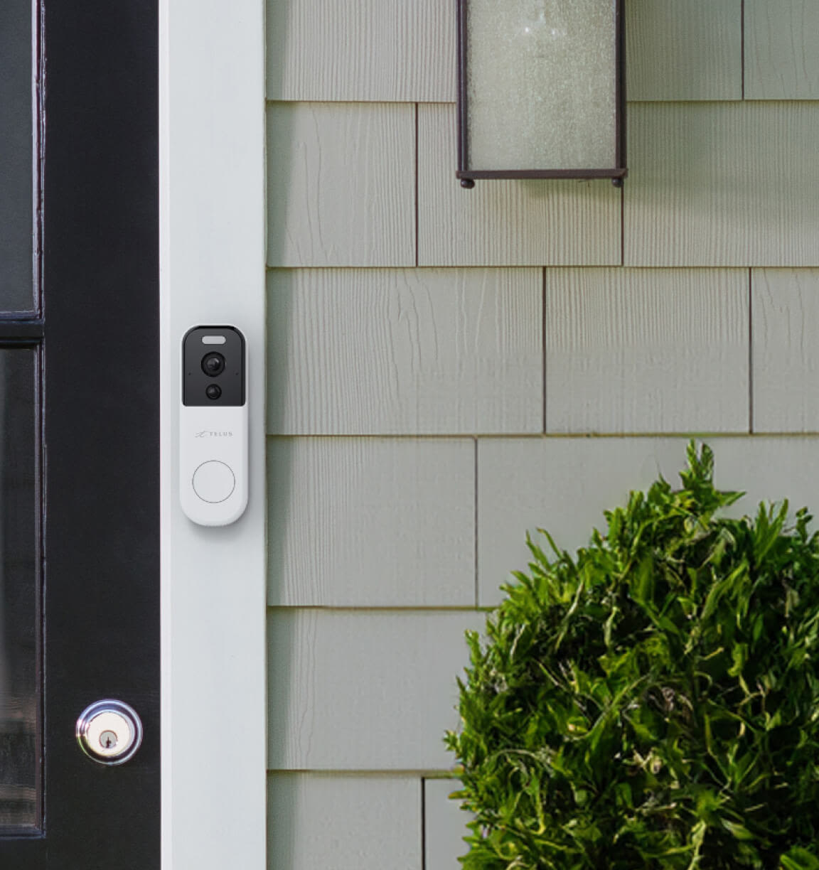 A TELUS Doorbell Camera is seen on a front door.