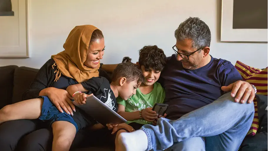Family hanging out on a couch together