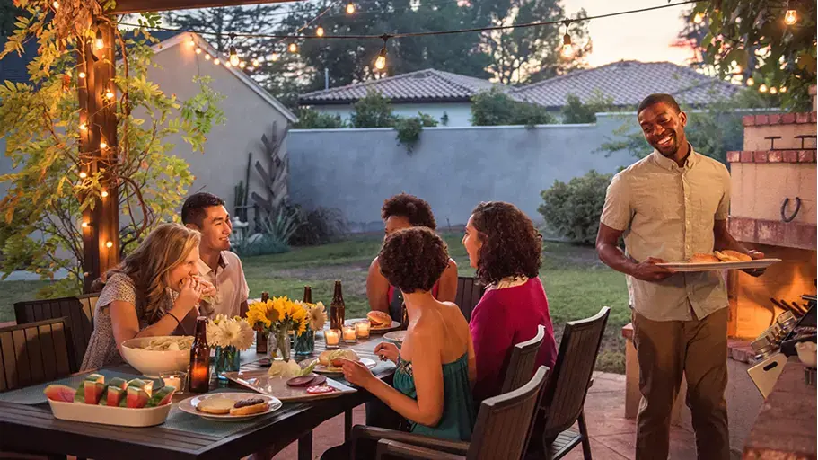People enjoying a barbecue together outside
