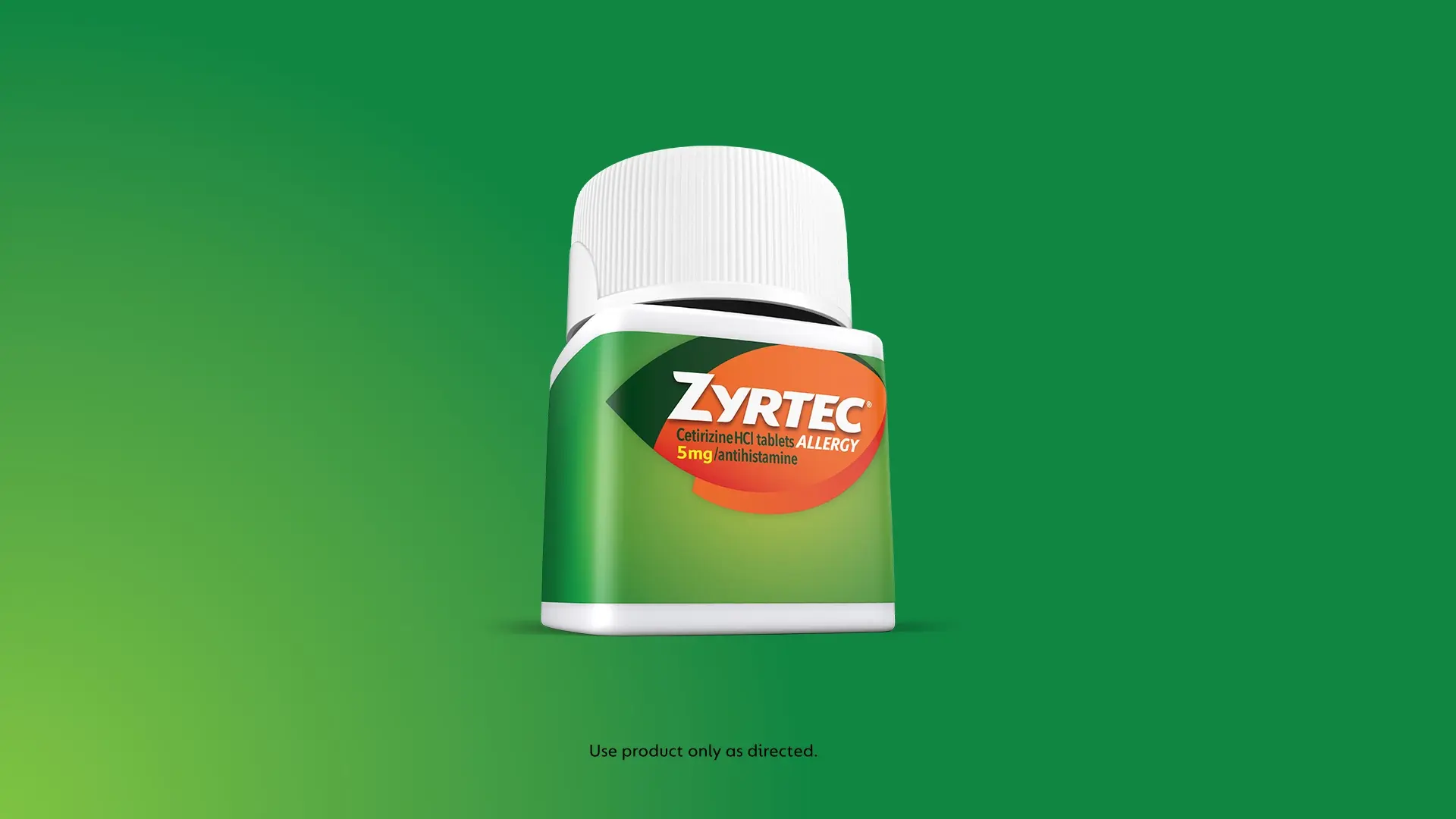 Bottle of Zyrtec Cetirizine HCl 5mg allergy tablets on a green background with a disclaimer to use the product as directed.
