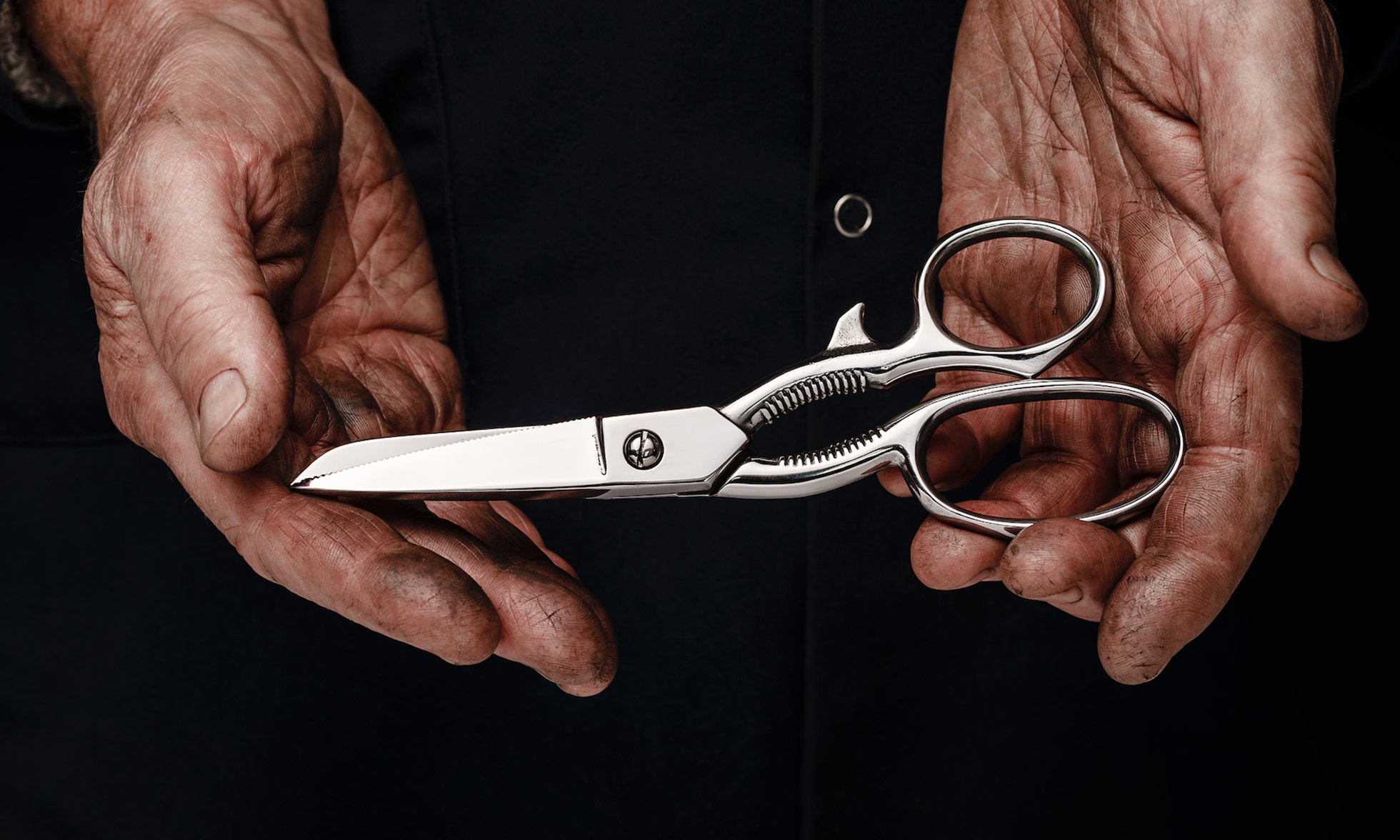 Craftsman holding scissors