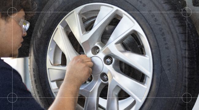 Close up of tire tread and wheel inspection at Belle Tire