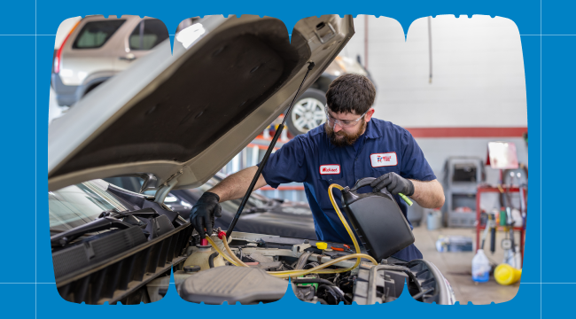 Belle Tire technician performing auto service and maintenance