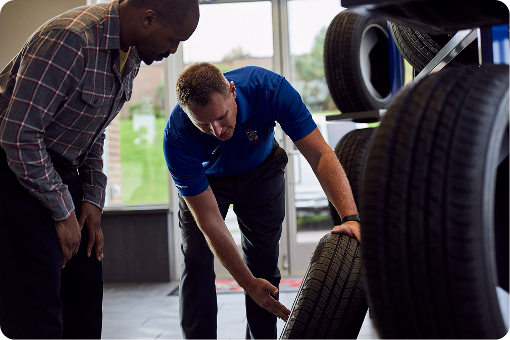 Belle Tire Employee Helping Customer