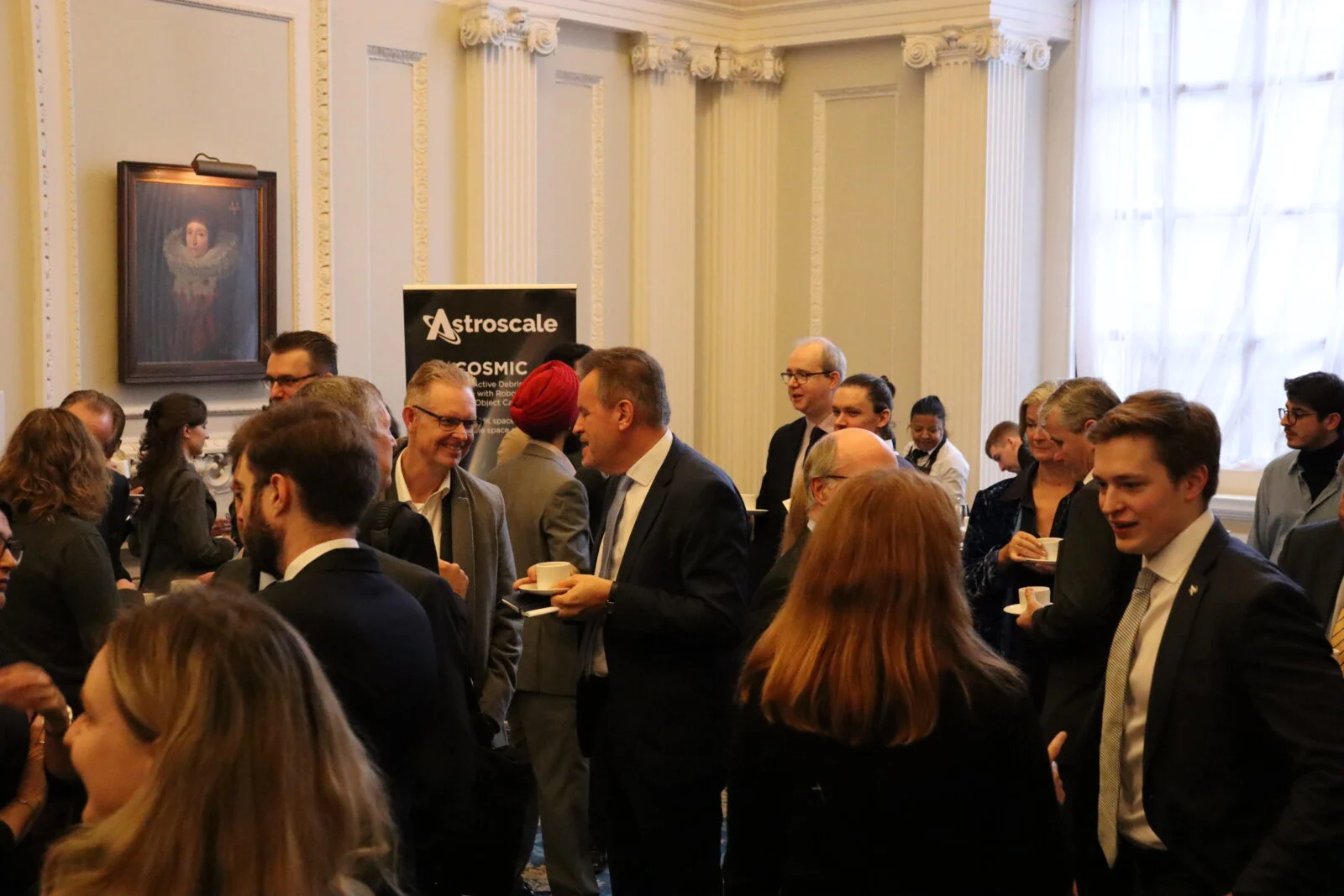 Attendees talking to one another at the event.