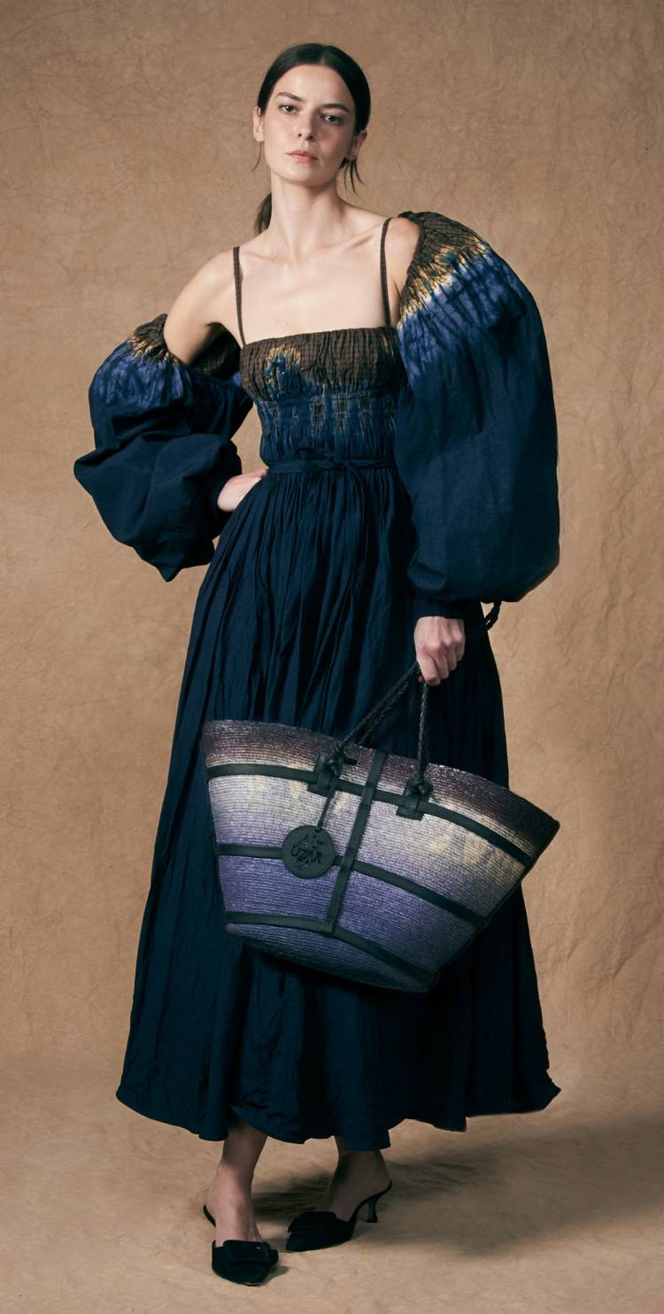 a model wears the andrea dress in berry blue dip dye from ss24 altuzarra