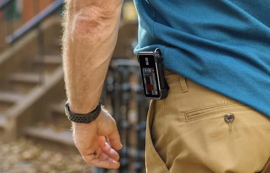 Pump user Al walking with his t:slim X2 pump clipped to his belt