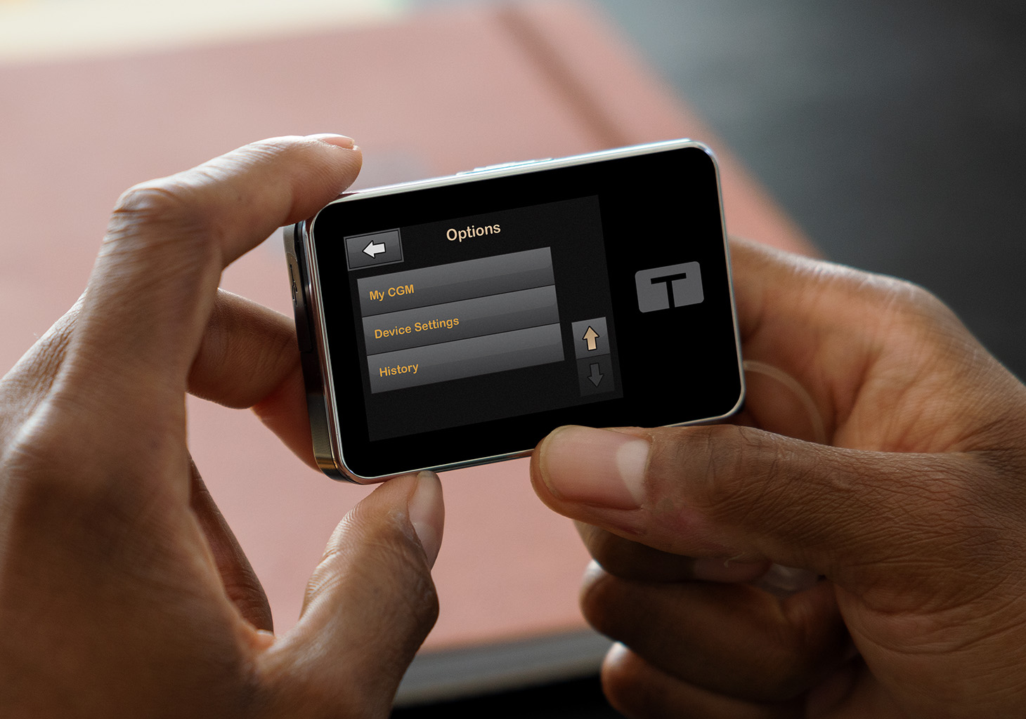 Woman Looking at Options Menu on t:slim X2 Insulin Pump