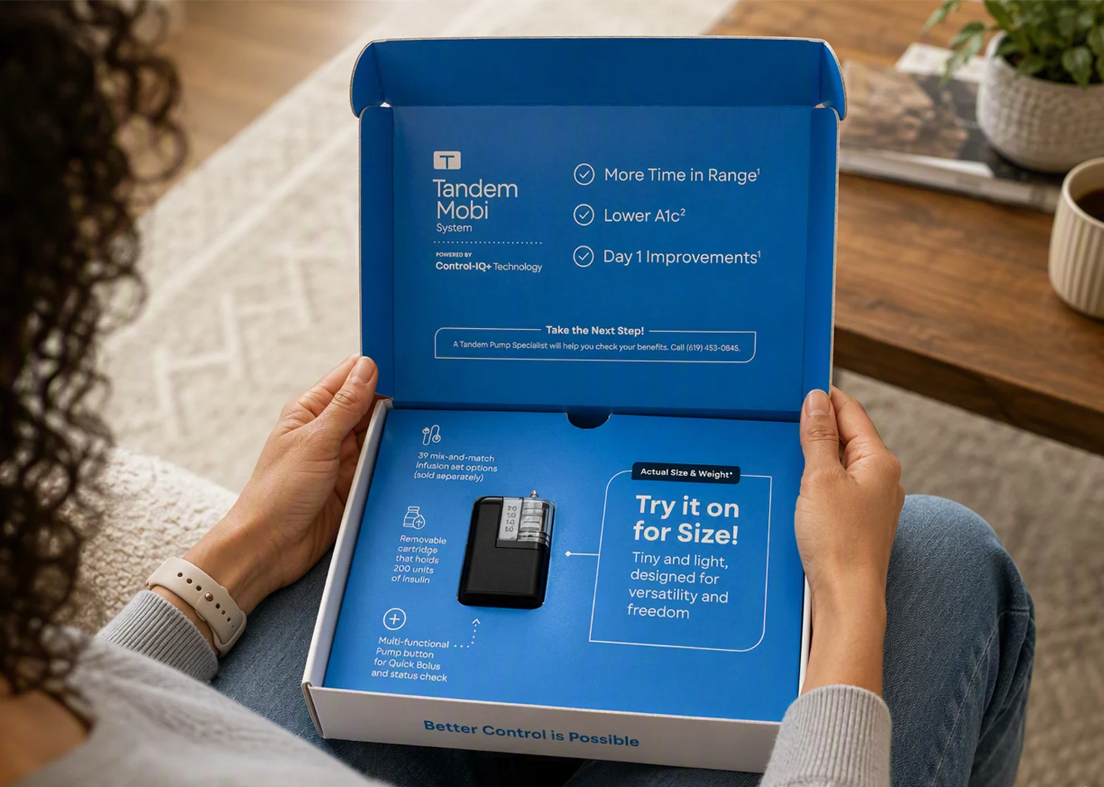 Person holding the Tandem Mobi try-it kit, showing the opened box