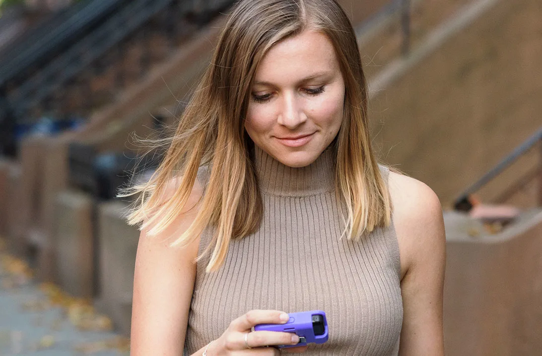 Woman looking at her Tandem t:slim X2 insulin pump screen