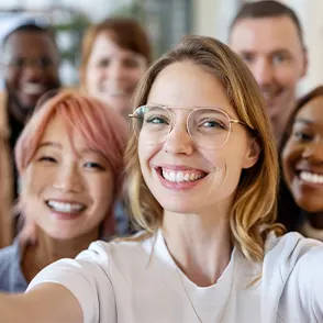 A group of six employees gathered for a selfie photo