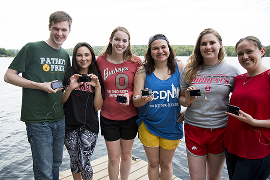 Riley Jenkins and five others colleague showing their t:slim X2 insulin pump