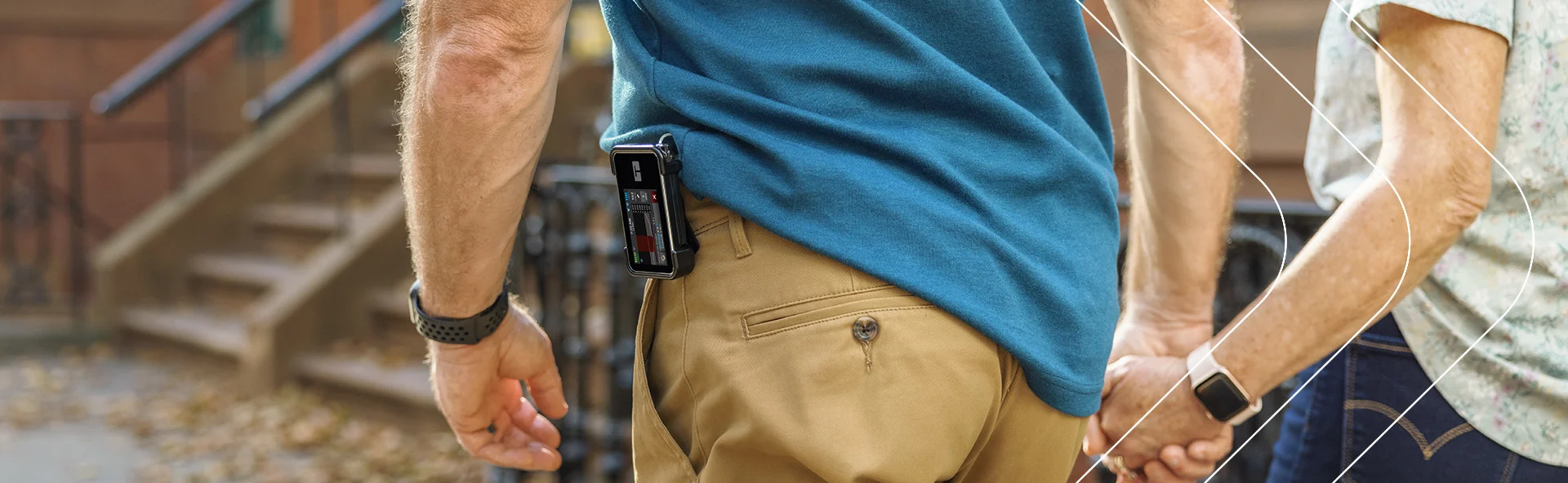 Pump user Al walking with his t:slim X2 pump clipped to his belt