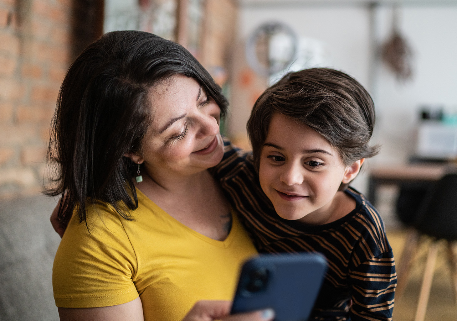 Woman with son looking at mobile app