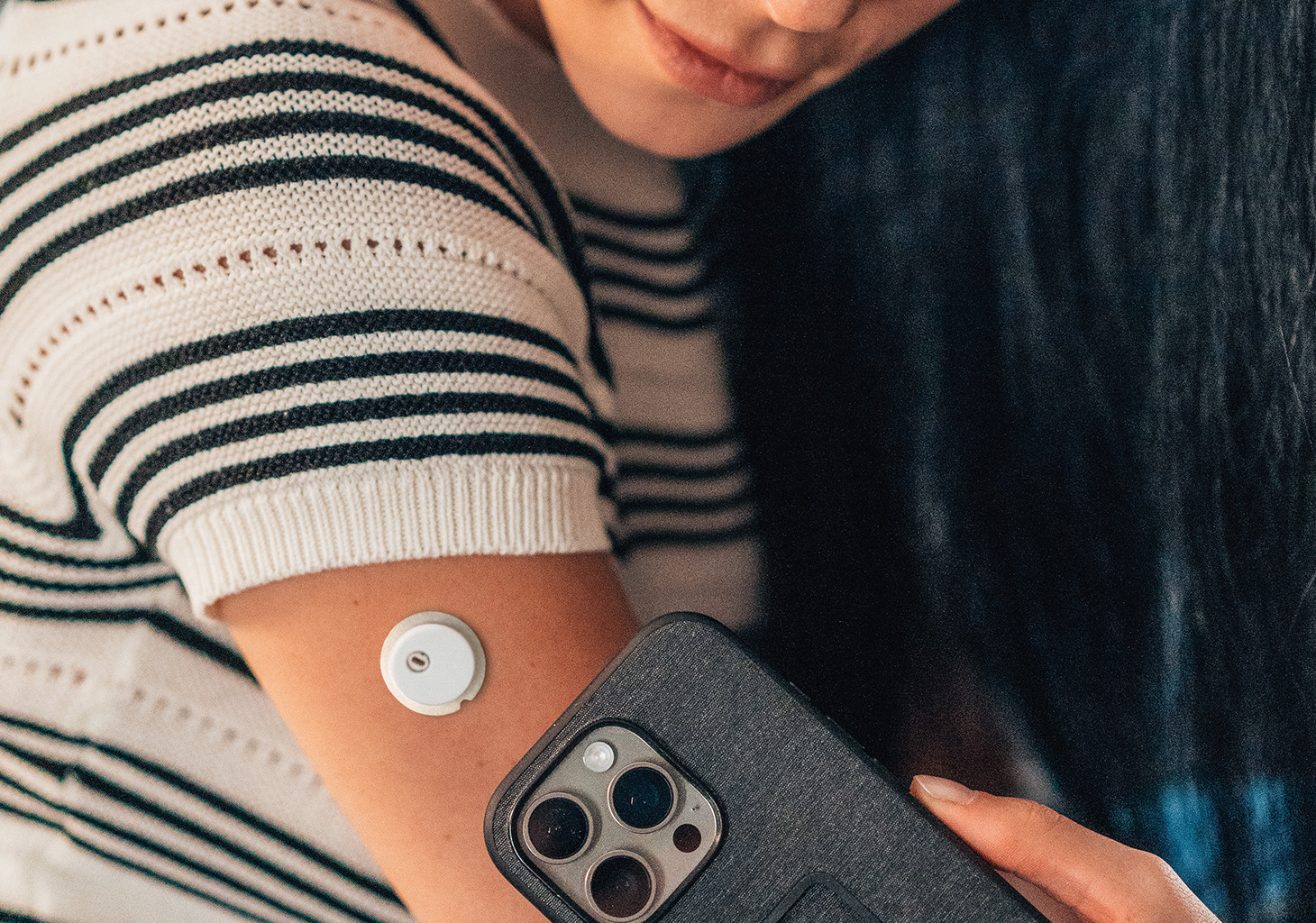 Woman Scanning FreeStyle Libre 3 Plus Sensor to Start Sensor Session in Mobile App