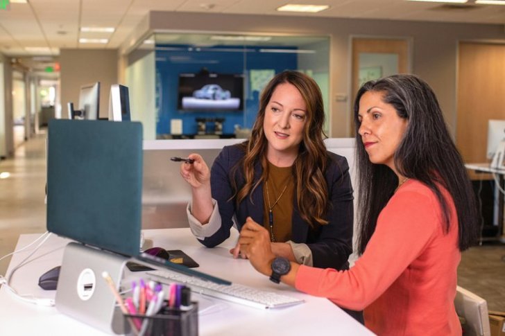 Two businesswomen talking