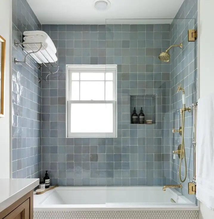 blue tile, gold hardware, shower niche, bathtub and shower surround tile, small bathroom design ideas